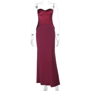 Detail of burgundy off-shoulder evening dress showing satin bodice and matte skirt textures