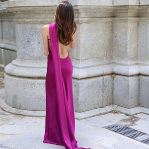 Elegant purple one-shoulder dress with a backless design and flowing sash detail