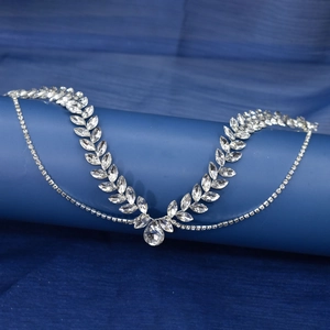 Detail of silver bridal hair vine with sparkling rhinestones and leaf motifs