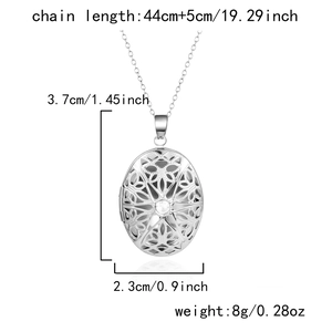 Detailed size parameters of silver oval filigree locket pendant with crystal center