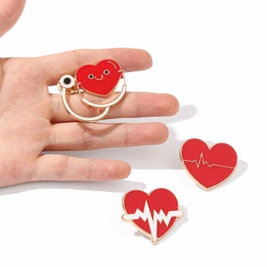 Medical enamel brooch set featuring stethoscope and heart rhythm designs for doctors