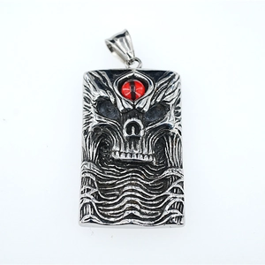 Retro punk square skull pendant with red evil eye detail and silver metal embossed design