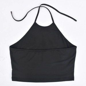 Detail of black halter crop top showing elastic knit fabric texture and neck tie design