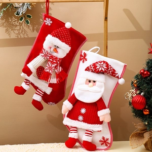 Pair of hanging knitted Christmas stockings with 3D Santa and Snowman motifs
