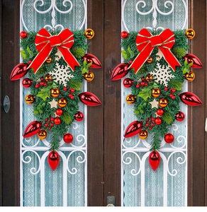 Detail of festive Christmas teardrop wreath with red bows, gold baubles, and snowflakes