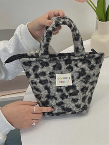Chic leopard print plush tote bag with zipper closure and soft faux fur texture