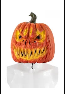 Front view of scary Halloween pumpkin latex mask with sharp yellow teeth for cosplay