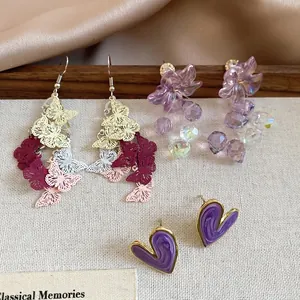 Three-piece Korean floral and butterfly stud earring set with purple heart designs