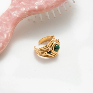Vintage gold layered open ring with green malachite stone and spiral texture on white background