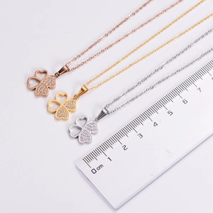 Detailed view of clover pendant size measurement showing three colors with a ruler