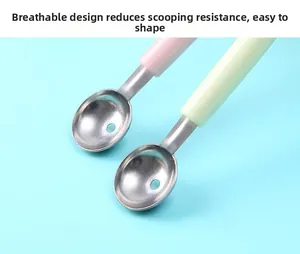Detail of stainless steel ice cream scoop with ventilation hole and pink plastic handle