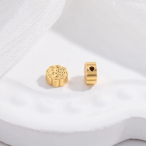 Macro detail of S925 sterling silver hollow flower beads with high-shine gold plating