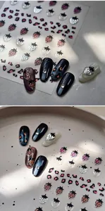 Detailed strawberry and pink leopard print nail stickers with glitter accents and 3D texture