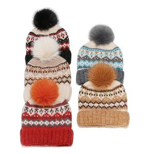 Fair Isle knitted beanies with fluffy pom poms in multiple Nordic patterns and colors