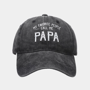 Detail of vintage washed denim baseball cap with white 'Call Me Papa' print text