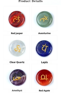 Macro view of polished seven chakra stones with golden engraved reiki symbols