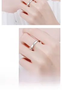 Detailed view of D-color princess cut moissanite silver ring worn by a male model
