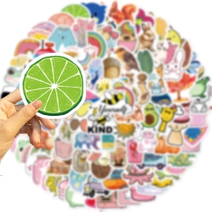 Close-up of a hand holding a lime sticker from a 100-piece cute DIY waterproof sticker set