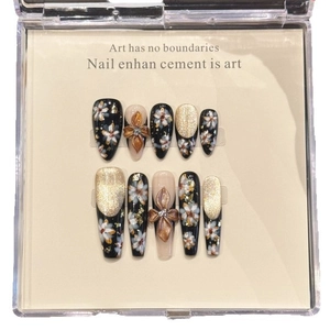 Handmade press-on nails featuring vintage gold floral art, cat eye effect, and 3D bow details