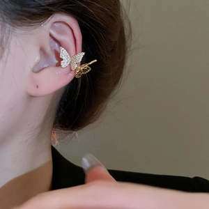 Detailed view of elegant gold butterfly ear cuff featuring sparkling cubic zirconia stones