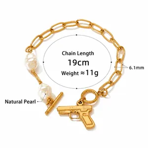 Detailed view of pearl bracelet with gold pistol charm showing 19cm length and 6.1mm width