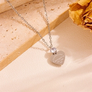 Silver heart necklace with engraved Eternal Love text and sparkling gemstone detail