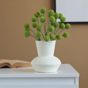 Minimalist white ceramic vase with green globe artificial flowers for home decor