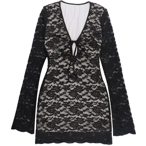 Detailed close-up of intricate black floral lace fabric with soft contrast lining