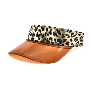 Detail of semi-transparent orange PVC visor with leopard print elastic headband