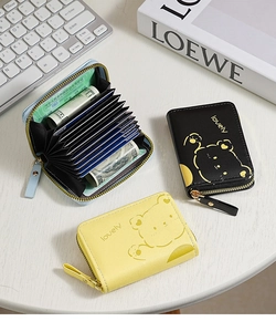 Detail view of colorful leather accordion card holders with multi-slot zipper design