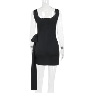 Detail of elegant black sleeveless slim dress with decorative bow and flowing ribbon
