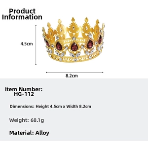 Detailed view of luxury baroque golden crown with red teardrop gems and white diamonds