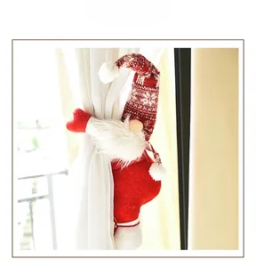 Detail of Christmas gnome curtain tieback with red knitted hat and plush white beard