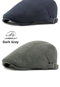 Detail view of cotton knitted beret hats in navy and grey with adjustable metal side buckle