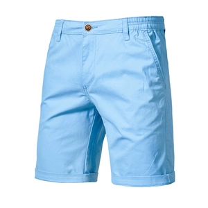 Detail of light blue casual men's shorts showing elastic waistband and brown button