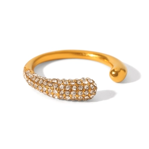 Macro shot of gold plated cuff with pavé set cubic zirconia and intricate metalwork