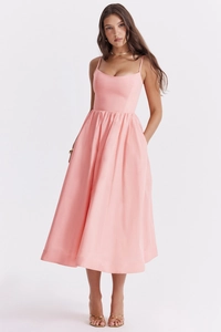 Close-up of pink spaghetti strap midi dress featuring elegant satin-like A-line silhouette