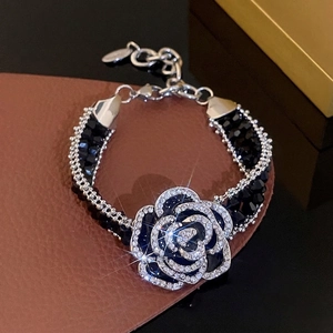 Elegant French camellia crystal bracelet with black beads and sparkling rhinestones