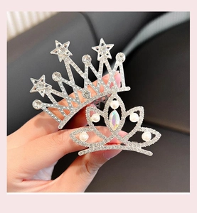 Detailed close-up of pearl and rhinestone crown hair combs for little girls hairstyles