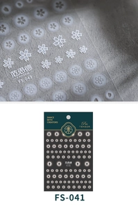 Macro detail of FS-043 cherry blossom and FS-041 star pattern matte nail art stickers