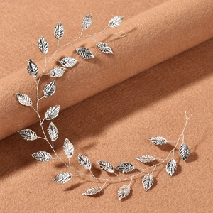 Detailed view of handmade silver leaf bridal headband with flexible wire and leaf texture