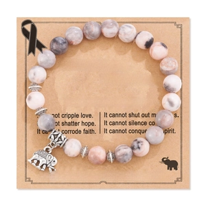 Detail of 8mm pink zebra stone beads bracelet and silver charm on sentiment card
