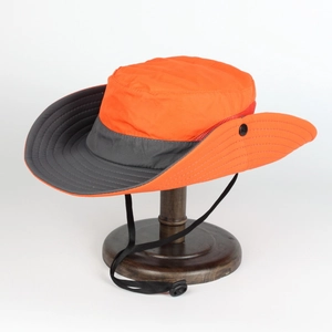 Detail of outdoor sun hat with orange crown, dark grey brim and adjustable chin strap