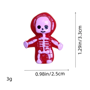 Detailed view of red resin skull charm with exact dimensions 3.3cm by 2.5cm and 3g weight