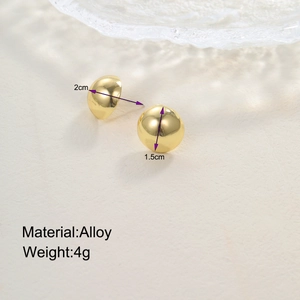 Detailed view of golden alloy teardrop earrings showing 1.5cm diameter and 4g weight