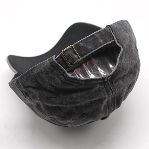 Detail of adjustable brass buckle and vintage washed cotton strap on baseball cap