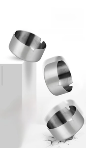 Action shot of durable gold stainless steel ashtray showing impact resistance and toughness