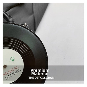 Close-up of black PU leather record bag with musical elements print and metal zipper