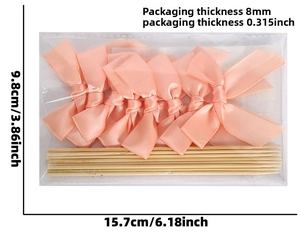 Detail view of pink satin bow cake toppers packaging size 15.7cm x 9.8cm with thickness info
