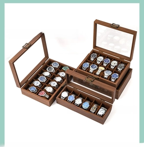 Detail view of wooden watch organizer box with glass top and vintage metal clasp